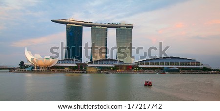 SINGAPORE - FEBRUARY 22: The Marina Bay Sands complex at night on February 22, 2013 in Singapore. Marina Bay Sands is an integrated resort billed as world\'s most expensive standalone casino property.