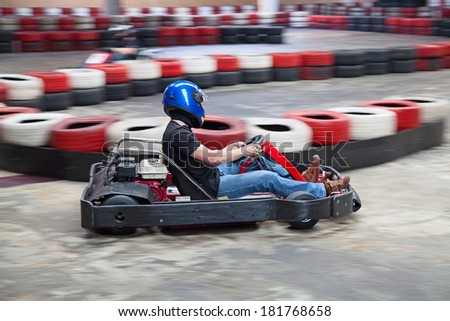 Indoor karting race (kart and safety barriers)