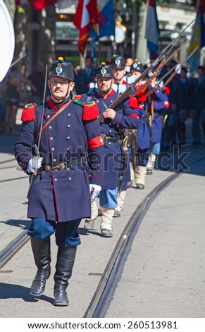 ZURICH - AUGUST 1: Swiss National Day parade on August 1, 2012 in Zurich, Switzerland. Unidentified people in historical uniform.