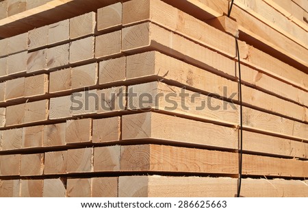 Stack of new wooden studs at the lumber yard