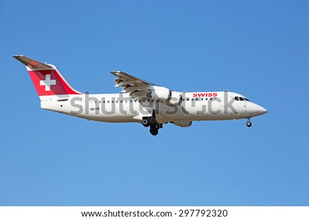 ZURICH - JULY 18: AVRO RJ100 landing in Zurich airport after short haul flight on July 18, 2015 in Zurich, Switzerland. Zurich airport is home port for Swiss Air and one of the biggest european hubs.