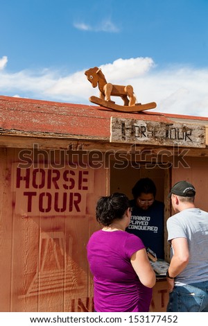 MONUMENT VALLEY, UTAH, USA - SEPTEMBER 26: Unidentified people buy Horse tour ticket  on September 26, 2012 in Monument Valley National Park.