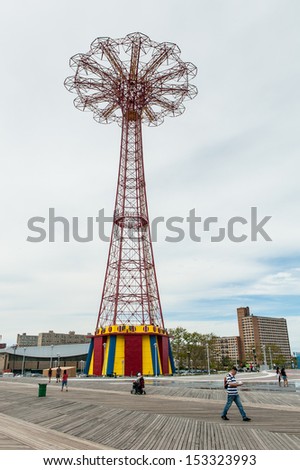 BROOKLYN, NEW YORK - AUGUST 23: Parachute jump tower and restored historical B&B carousel in Brooklyn on August 23, 2013. Jump tower has been called the \