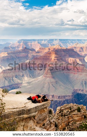 GRAND CANYON, ARIZONA, SEPT 25: Unidentified people look at the Grand Canyon on Sept 25, 2012 in Arizona. The Grand Canyon is a steep-sided canyon carved by the Colorado River in the state of Arizona.
