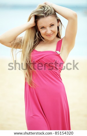 Middle aged woman resting at beach near the sea