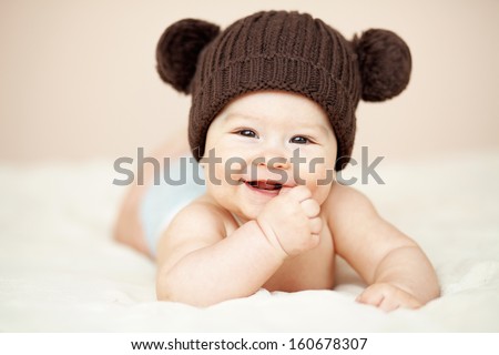 Similar – Image, Stock Photo portrait of beautiful baby girl at home sitting on the sofa playing with a garland of lights