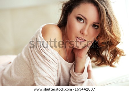 Home portrait of beautiful young woman, selective soft focus