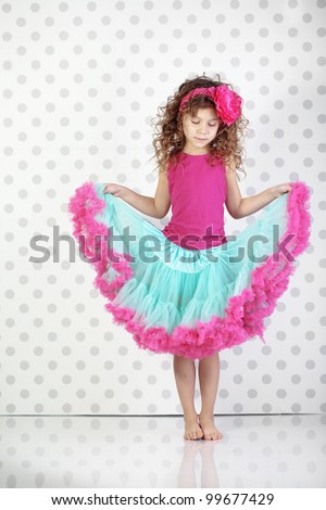 Studio portrait of cute little princess wearing beautiful tutu skirt