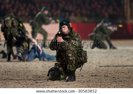 WINDSOR - MAY 14: Royal Marine Commandos in combat exercise at the Windsor Royal Tattoo  on May 13, 2009 in Windsor, UK.