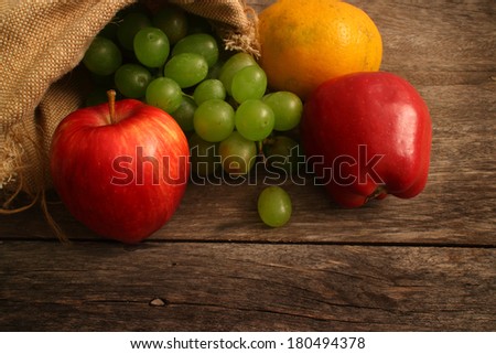 Vintage Autumn border from apples and fruits  on old wooden table/Thanksgiving day concept/background with apples