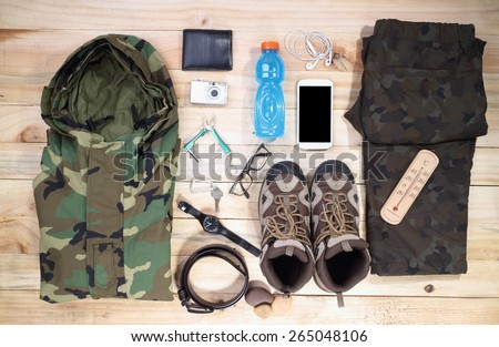 travel outdoor camping equipment set on wood background