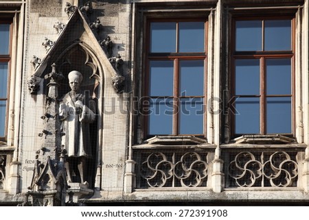 Medieval Town Hall building with spires Munich Germany. The first floor looks towards the Marienplatz- used for festivals and public events. The daily clock tower show is a tourist attraction.