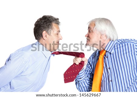businessman pulling a tie to younger man on white background