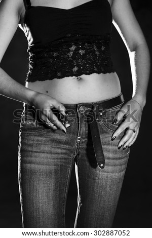 sexy woman unzipping her jeans