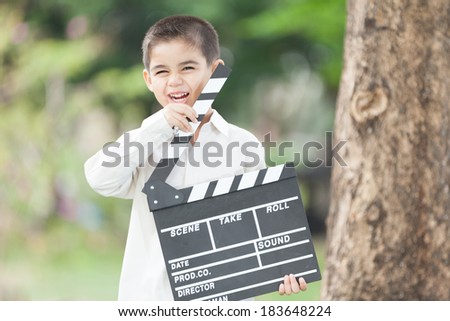 Little boy playing with slate