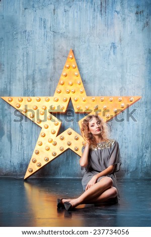 beautiful young woman in studio.luminous stars