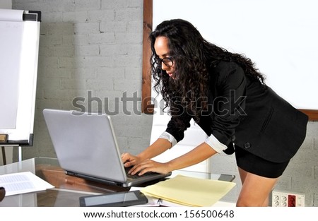 secretary in his office working with your computer