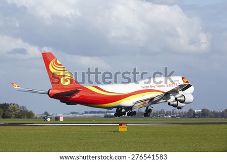 AMSTERDAM, THE NETHERLANDS - MAY, 7. A Boeing 747-481F of Yangtze River Express lands at Amsterdam Airport Schiphol (The Netherlands, AMS) on May 7, 2015. The name of the runway is Polderbaan.