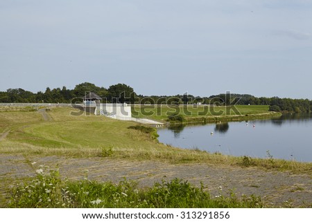 ALFHAUSEN, GERMANY - AUGUST, 1. The Alfsee (lake, reservoir) in Alfhausen (Germany, Lower Saxony) is a flood control reservoir and local recreation area and photographed on August 1, 2015.