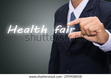 businessman hand write a Health fair