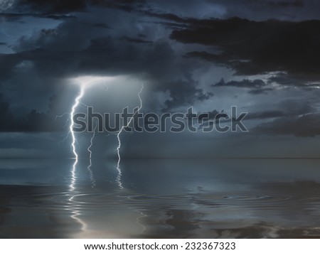 lightning bolts reflection over the sea