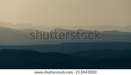 mountain silhouette in the desert at sunset sunrise