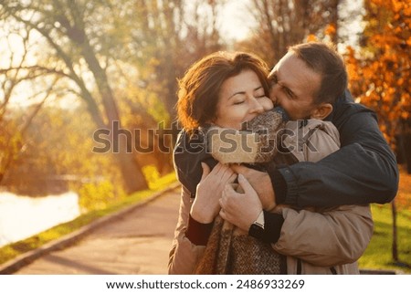 Similar – Image, Stock Photo Tree cuddling | woman hugging a pine trunk