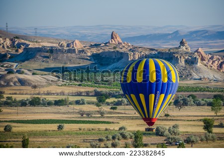 GOREME, TURKEY - JUNE 15: Hot air balloon in process of landing on June 15, 2014 in Goreme, Cappadocia, Turkey.Cappadocia is a historical region in Central Anatolia in Turkey.