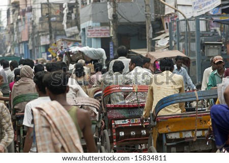 DELHI, INDIA - JULY 17: Unidentified people in crowded street in Old Delhi. July 17, 2008 in Delhi, India.
