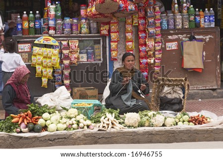 LADAKH, INDIA - AUGUST 22: Unknown Ladakhi ladies selling fruit and vegetables by the side of the road in Leh August 22, 2008 in Ladakh, India