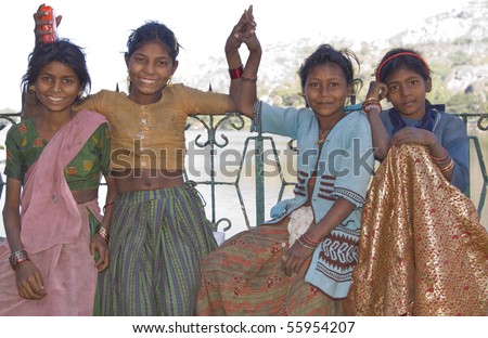 MOUNT ABU, INDIA - NOVEMBER 2: Group of very poor but happy children dressed in rags on November 2, 2007 in Mount Abu, Rajasthan, India