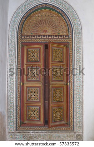 Ornate painted door in the 19th century El Bahia Palace in Marrakesh, Morocco.