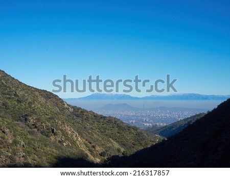 Layer of smog sitting over the city of Santiago, capital of Chile. Viewed from Parque Aguas de Ramon in the foothills of the Andes Mountains