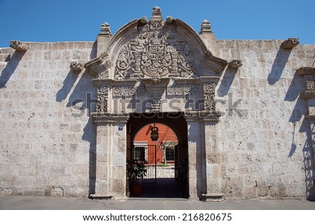 Ornate stone carved entrance to the 18th century baroque style Spanish colonial house in Arequipa, Peru