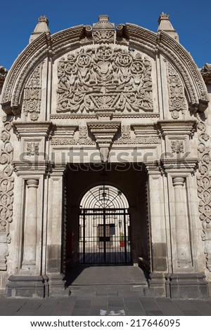 Ornate carved stonework at the entrance to the 18th century baroque style Spanish colonial house Casa Tristan del Pozo in Arequipa, Peru