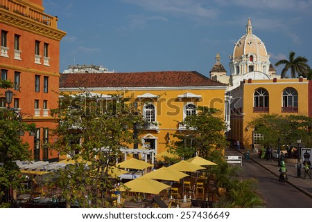 CARTAGENA, COLOMBIA - JANUARY 24, 2015: Colourful umbrellas shelter diners from the sun in the Plaza Santa Teresa in the historic city of Cartagena de Indias in Colombia,
