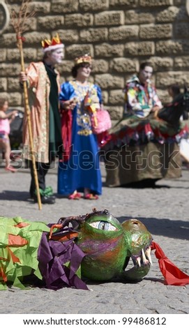 BATH, ENGLAND - APRIL 23: Street artists re-enacting the story of St George and the dragon on April 23, 2011 in Bath, Somerset, England as part of the St Georges Day celebrations.