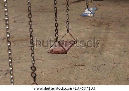An old swing at abandoned playground