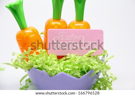 Easter Sunday Carrots Purple bowl with carrots and a 'Easter Sunday' sign.