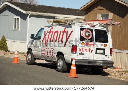 WESTMINSTER, COLORADO/U.S.A. - MARCH 20, 2013: Comcast xfinity van parked on the street in front of a customers home. On the side and back of the van is the company logo.