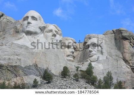 Mount Rushmore National Memorial The sixty foot faces of past United States President\'s.  George Washington, Thomas Jefferson, Theodore Roosevelt,Abraham Lincoln carved in granite.