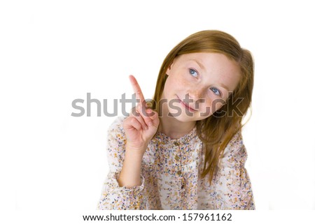 Teen girl points finger at something