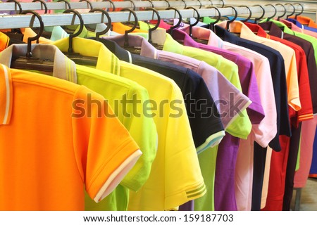 colorful  fashion clothing on hangers at the show