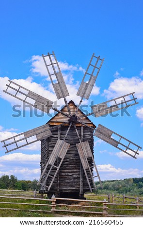 Old wooden windmill on background of blue sky, Kyiv region, Ukraine/Wooden windmill/Old wooden windmill