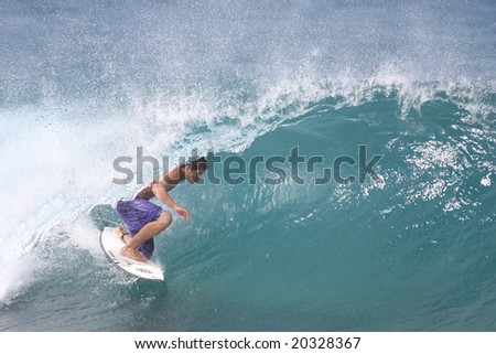 Hawaii - Nov. 8: Kekoa Cazimero is one of Hawaii\'s rising young surf stars and competes in the Triple Crown of Surfing, here he gets a nice little tube ride at Rocky Point, Nov. 8, 2008 in Hawaii.