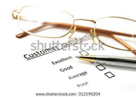 customer satisfaction survey form with the pen and eye glasses