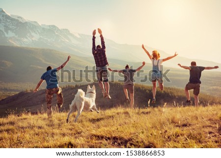 Image, Stock Photo Group of friends jumping and tossing ball up