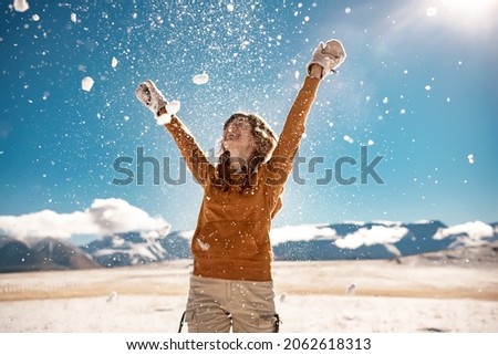 Image, Stock Photo Woman playing with snow on winter field