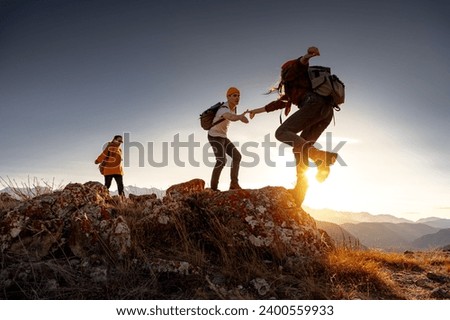 Similar – Image, Stock Photo Tourist with backpack walking among high rocks