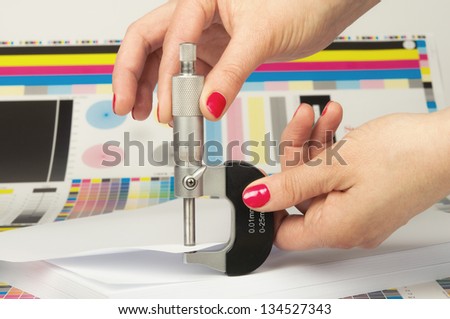 Measurement of thickness of a sheet of paper by a micrometer in printing house